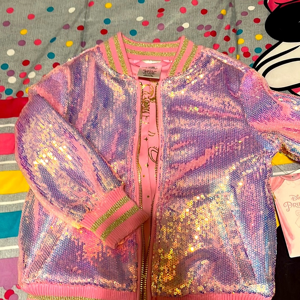 NWT size 3 little pink jacket!!! Liner has some princess movie symbols!